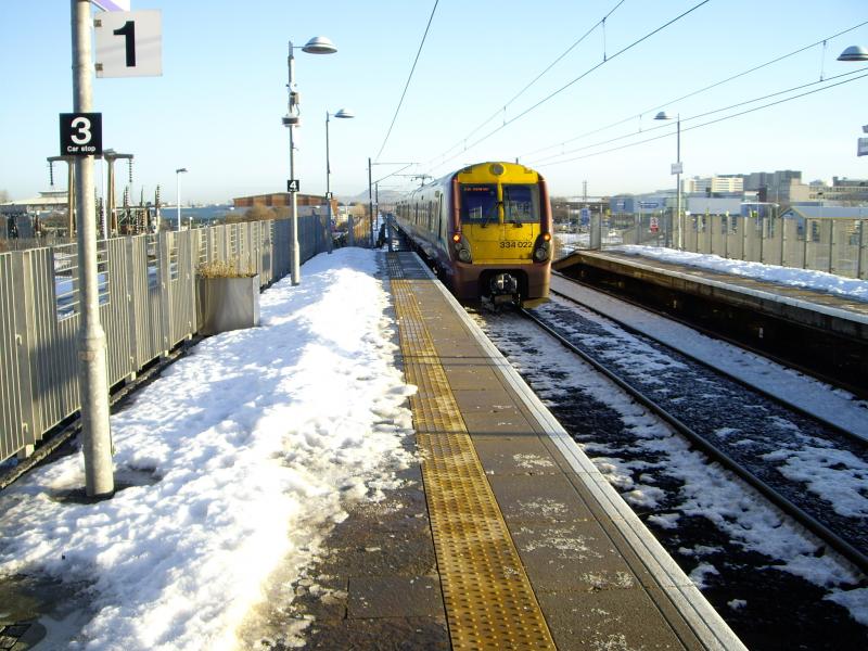 334022 at Edinburgh Park: 334022 leaves Edinburgh Park on 09:55 Helensburgh Central to Edinburgh, this was the return leg first possible electric from Edinburgh Park to Glasgow Queen Street. Photo of 334022 at Edinburgh Park