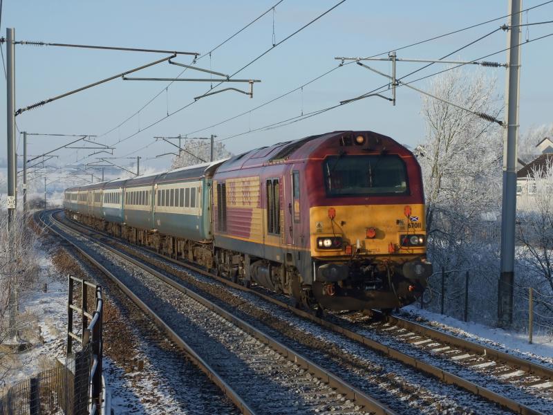 Beast bombing it at Carluke: DBS 67011 bombs it through Carluke, seriously I could hear this thing a good 2 minutes before it came round the corner! Photo of Beast bombing it at Carluke
