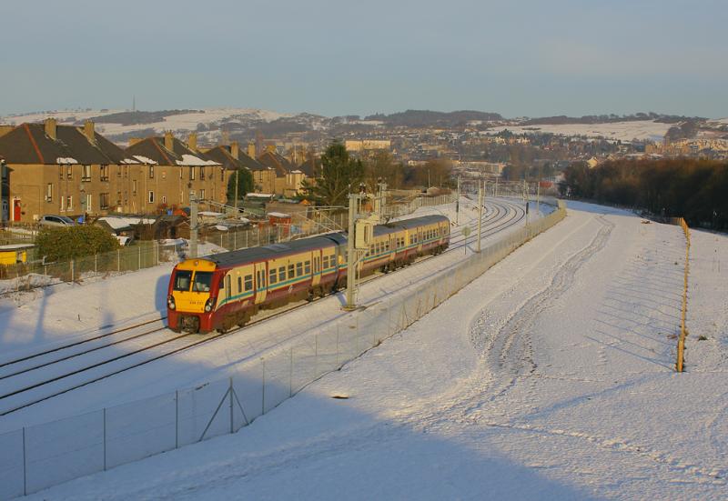 Bathgate 334: 334021 departs Bathgate on the 13.47 service along the new line to Airdrie on 13.12.10. This was the second day of offical passengers services on the new line. Photo of Bathgate 334