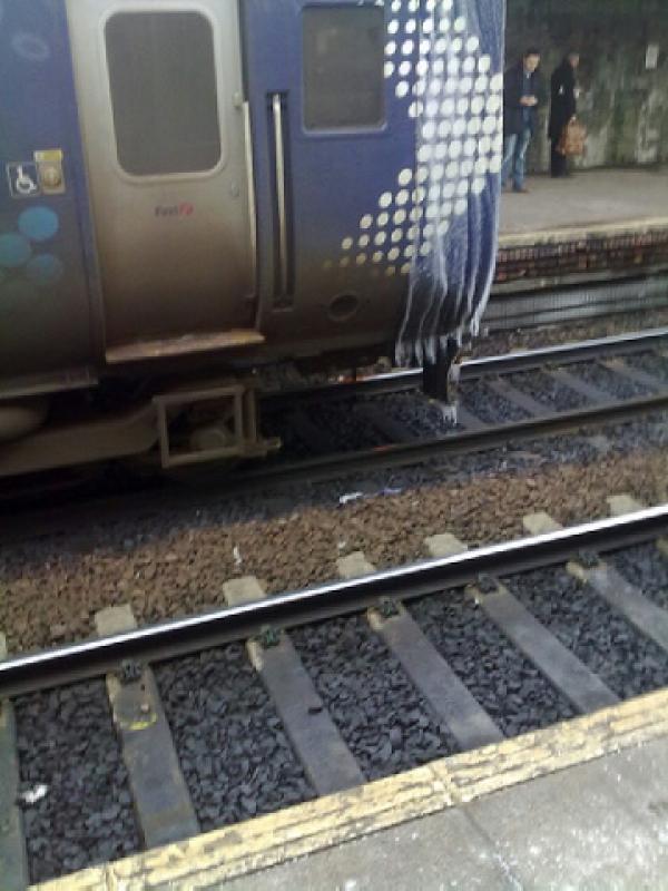 Iced up 156513: 156513 iced up on Fri 07 Jan at Haymarket forming the 1256 Edinburgh to Glasgow Central service. Was was running from roof of unit, but freezing as it ran down the side, resulting on icles on side of unit and also on plough Photo of Iced up 156513