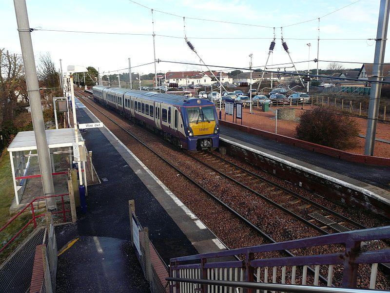 334012 at Barassie: 334012, the unique Juniper set with blue ends and roof, passes through Barassie at 11.38 with the 11.00 ex GLC due into Ayr at 11.52 Photo of 334012 at Barassie