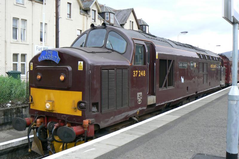 37.248 on Jacobite at Fort William: 28th May 2008 was so dry that the fire risk from the steam loco was considered too great so 37.248 ran the service instead. Photo of 37.248 on Jacobite at Fort William