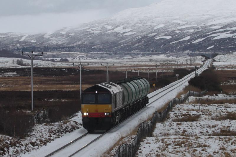 Lairg tanks head south: With a muirburn patchwork behind it, 66427 heads south towards Dalwhinnie on 10 January 2011 with the empty fuel tanks from Lairg Photo of Lairg tanks head south