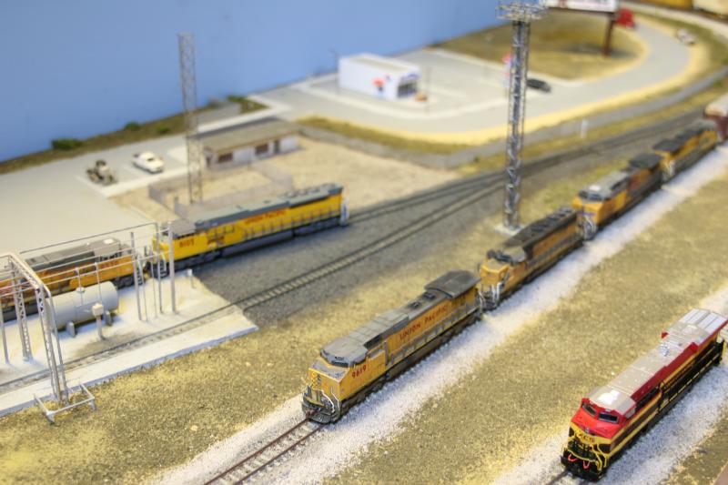 N scale N.American by S.Braid: UP Dash 9-44cw + UP SD40-2 + UP AC4400CW UP Dash 8-40B with an autorack surrounded by UP SD70ACE + UP SD90/43 + KCS ES44AC Photo of N scale N.American by S.Braid