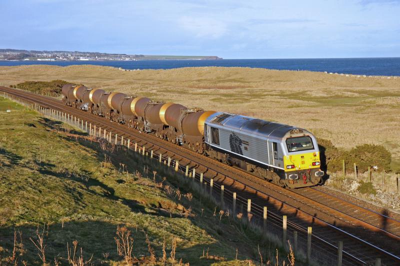 67029 with 6D83 - Inverpeffer: 67029 is seen passing Inverpeffer south of Arbroath with 6D83 Dyce Raiths Farm to Mossend. Photo of 67029 with 6D83 - Inverpeffer