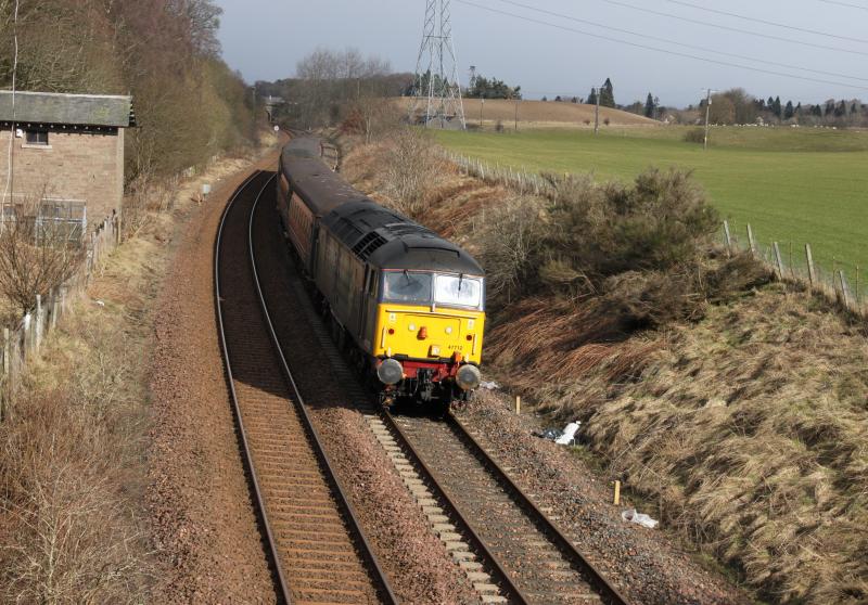 DRS 47712 at Demarkfield farm: DRS 47712 rounds the curve at Demarkfield farm, today see only the one loco as 47802 had flat batteries. 5Z71 Inverness - Perth on 9/3/11 driver/route knowledge training Photo of DRS 47712 at Demarkfield farm