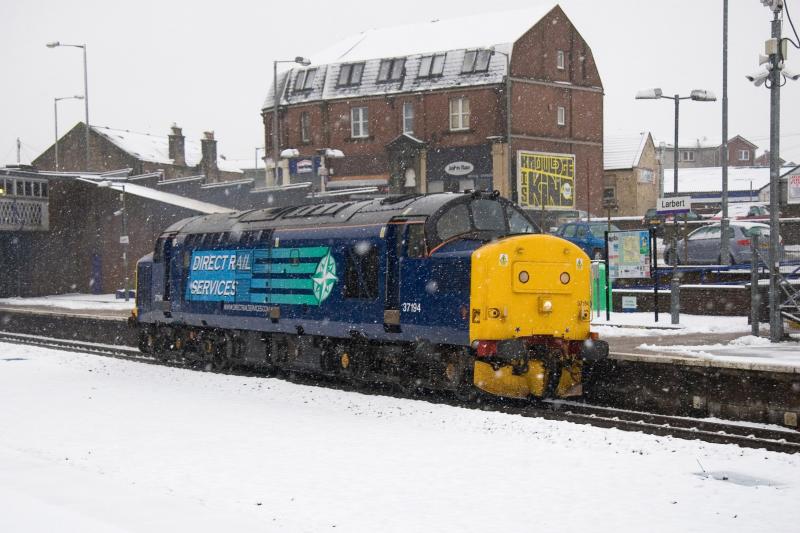 37194 on snowplough duties: With a heavy fall in the Highlands, 37194 was despatched from the DRS depot in Carlisle and is seen speeding towards Perth and Inverness at Larbert in suitably adverse weather conditions 120311 Photo of 37194 on snowplough duties