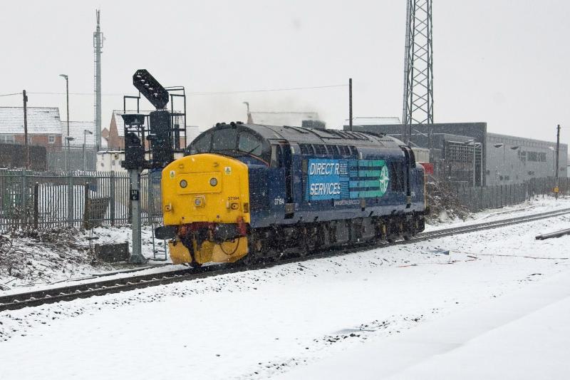 37194 heads for the Highlands: 37194 heads away from Larbert and passes the Network Rail training centre on 0Z99 Grangemouth - Inverness snow plough duty 120311 Photo of 37194 heads for the Highlands