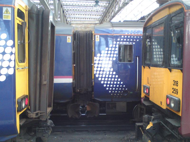 class 156 and class 318: Four trains at Glasgow Central in three different liveries Photo of class 156 and class 318