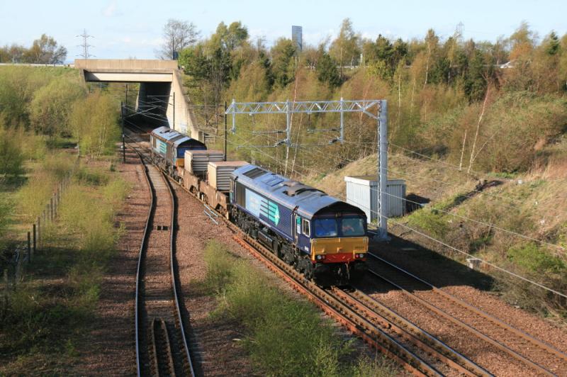 Flasks at Millerhill: 66417 leading 66424 on 6M50 15.07 Torness to Carlisle leaving Millerhill passing a new catenary support on 12/04/2011.( better for photos ) Photo of Flasks at Millerhill
