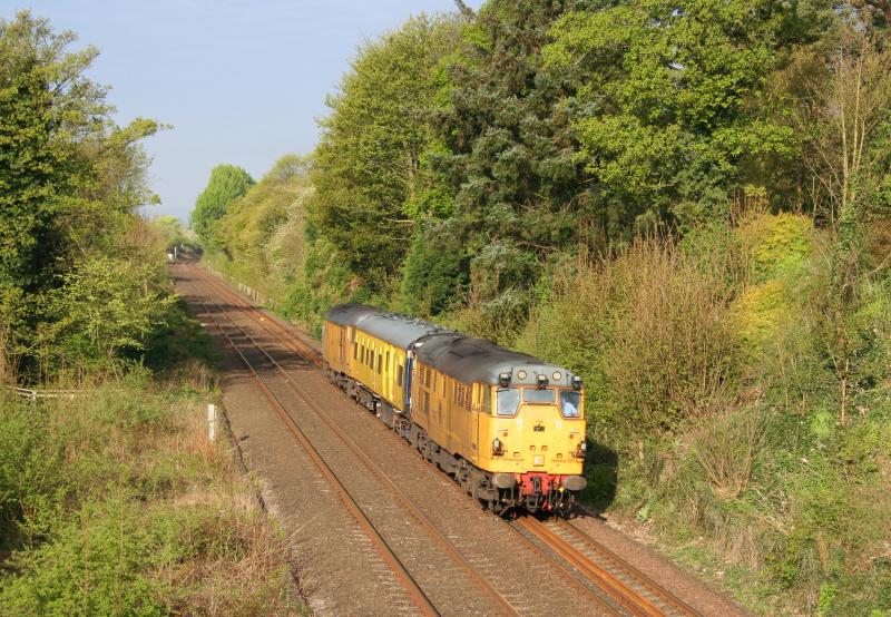 31233 31602 2Q88 Invergowrie:
31233 top and 31602 tail pass Invergowrie on 2Q88 track inspection coach on a sunny 18th April 2011 Photo of 31233 31602 2Q88 Invergowrie