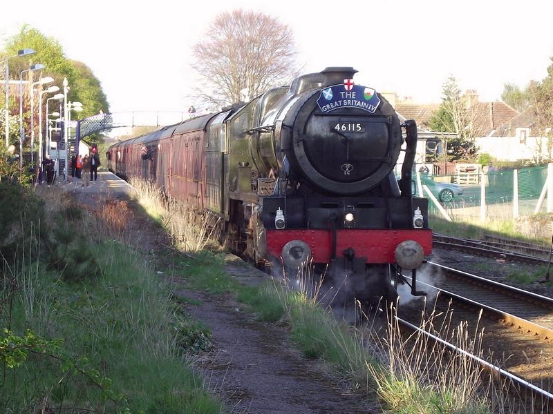 46115 at Nairn: Rebuilt Scot 46115 'Scots Guardsman'
departs Nairn with 1Z28, the 09:44
Edinburgh - Aberdeen - Inverness leg
of the 'Great Britain IV'. Photo of 46115 at Nairn