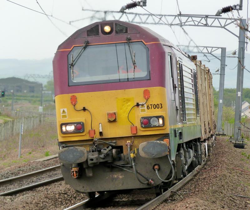67003 on the Bins: 67003 through Prestonpans on the Powderhall to Oxwellmains binliner 25 April 2011. Damage to front panel? Photo of 67003 on the Bins