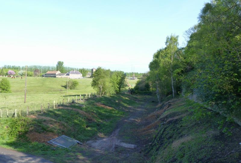 Border railway route near Millerhill: Old trackbed at Kings Gate Bridge, near Millerhill with drilling rigs on what will be the new alignment Photo of Border railway route near Millerhill