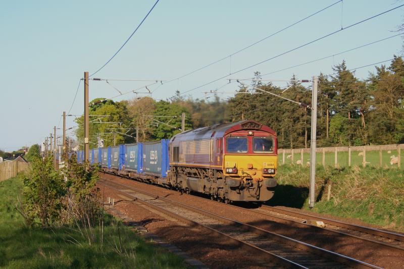 66164 Diverted Stobart:
66164 approaches Midcalder Jn with 4S43 Rugby to Mossend diverted via the ECML and Shotts Stobart Rail service on 30th April 2011 Photo of 66164 Diverted Stobart