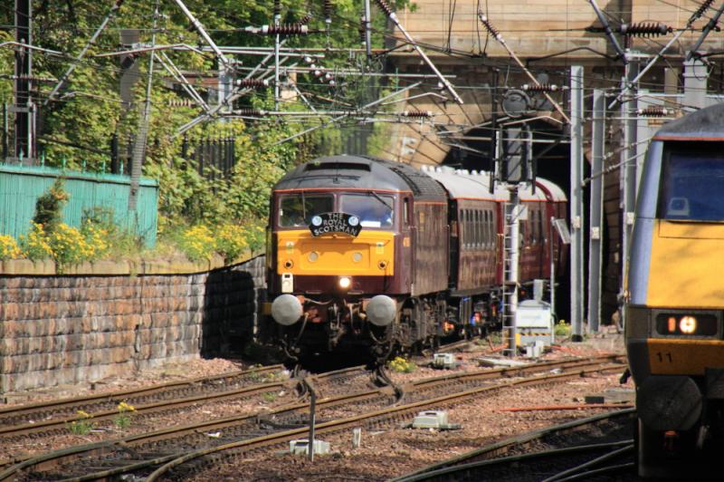 47851 moused in Princes St Gardens: 47851 on 1H79 13.43 Edinburgh to Keith about to disappear behind 91111 in Princes St Gardens on 02/05/2011. Everything perfect ,full sun, clean WCR 47 at last. Next time? Photo of 47851 moused in Princes St Gardens