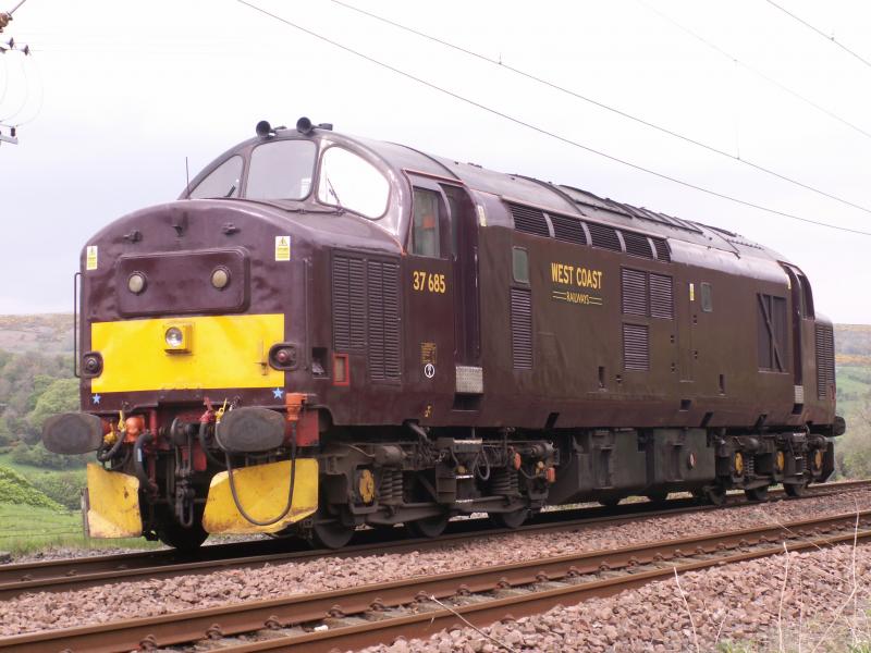 37685: WCR 37685 waits to cross a Glasgow to Wemyss Bay service in Dunrod Loop Greenock, it worked the Royal Scotsman into Wemyss Bay the previous day and was now heading light to another turn. 7th May 2011 Photo of 37685