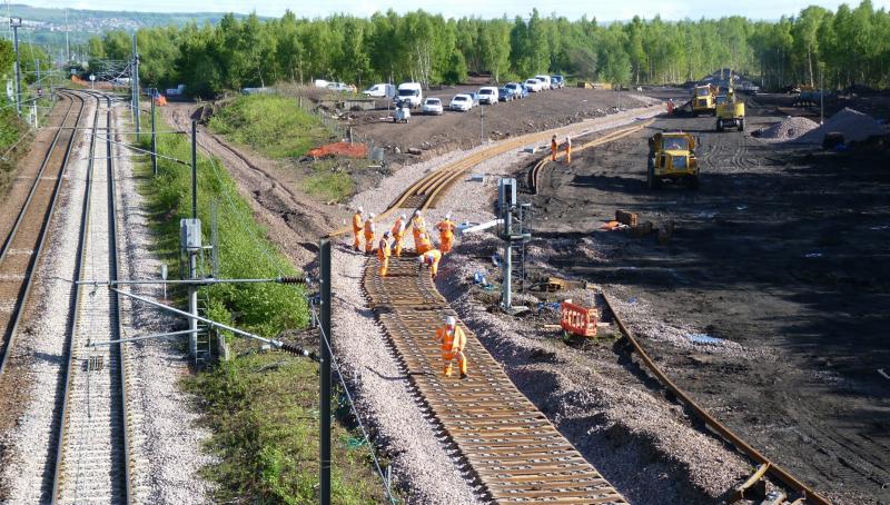 sleepers laid on new formation of Border Rail link: Steel sleepers being placed on the formation of the new Border rail link at Millerhill Photo of sleepers laid on new formation of Border Rail link