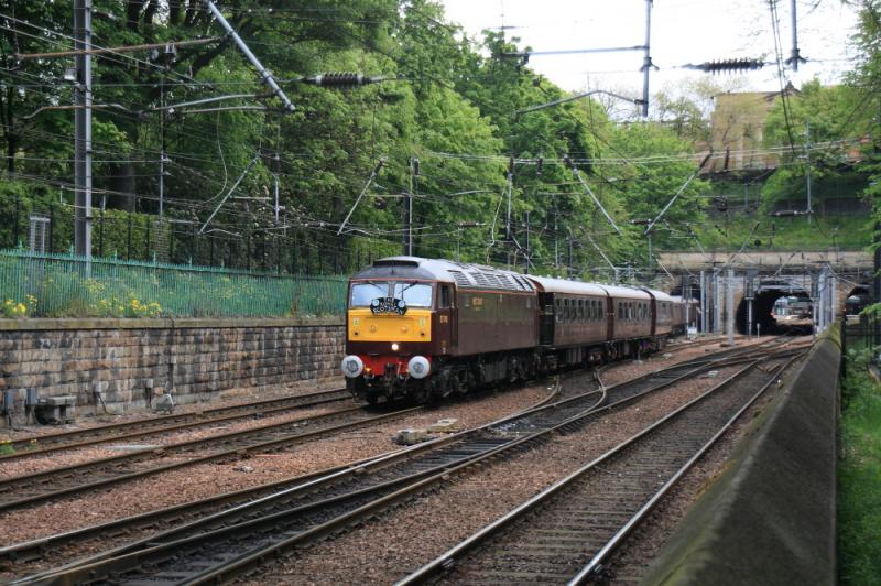 57001 on The Royal Scotsman: 57011 on 1H79 13.43 Edinburgh to Keith classic Royal Scotsman in Princes St gardens on 09/05/2011 during a cloudy spell. 2nd attempt to get this in sun class 91 had cleared by 30 seconds. Photo of 57001 on The Royal Scotsman