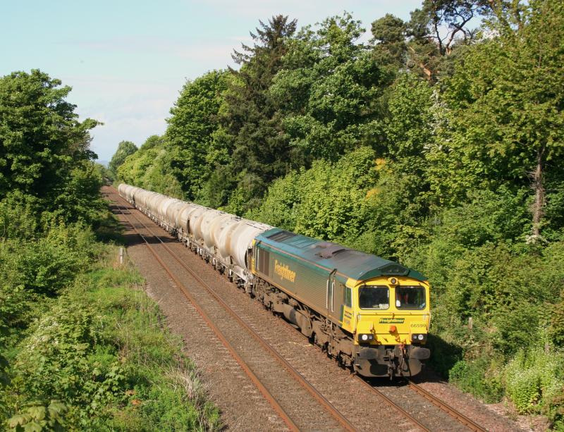 66599 6A65 09/05/11 Invergowrie:
66599 approaches Invergowrie while working 6A65 Oxwellmains to Aberdeen Craiginches on 9th May 2011 Photo of 66599 6A65 09/05/11 Invergowrie