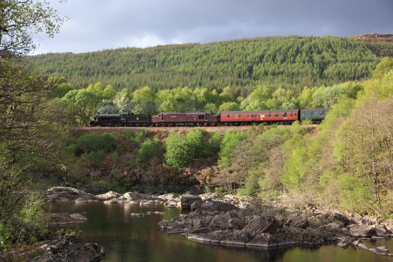 Cathedrals Explorer at Inverlair Falls: The Cathedrals Explorer passes Inverlair Falls near Tulloch on 8/5/11, headed by 61994 and 37 676. Photo of Cathedrals Explorer at Inverlair Falls