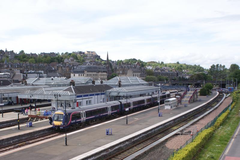 Turbostar at Stirling: Stirling Station is great to picture , especially from the added bonus from the ultra new pedestrian bridge , which spans the station. Photo of Turbostar at Stirling