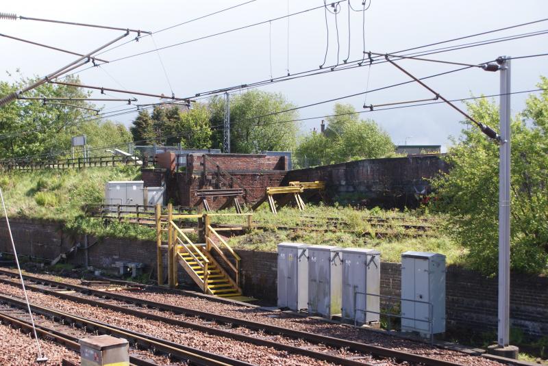 Old stops at Carstairs Junction: With the WCML downline in the foreground , three sets of elderly buffers are seen on the disused elevated stabling section at Carstairs Junction Station. Photo of Old stops at Carstairs Junction