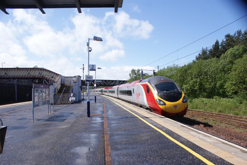 390 Pendo.: Virgin 390 EMU zips through Carstairs Junction ahead of a heavy shower. Photo of 390 Pendo.