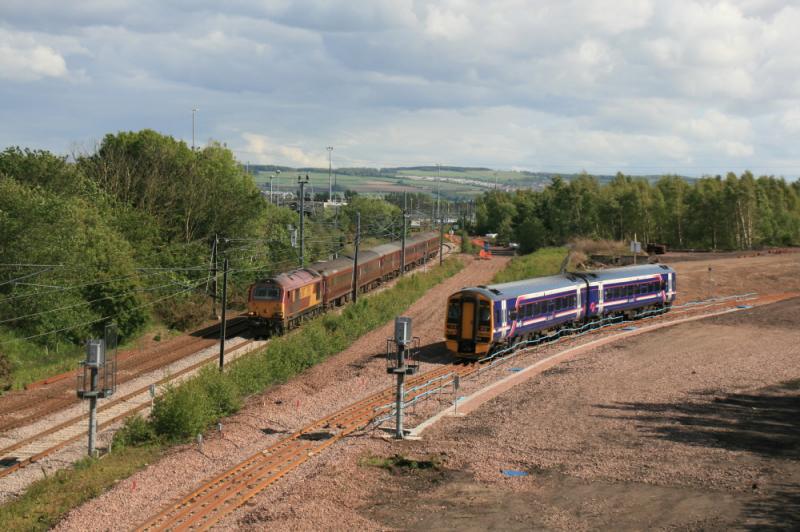Fife Circle ECS: 67007 on 5G13 16.28 Millerhill to Waverley passing 158734 on the 16.47 Newcraighall to Kirkcaldy at the north end of Millerhill Yard on 30/05/2011 Photo of Fife Circle ECS
