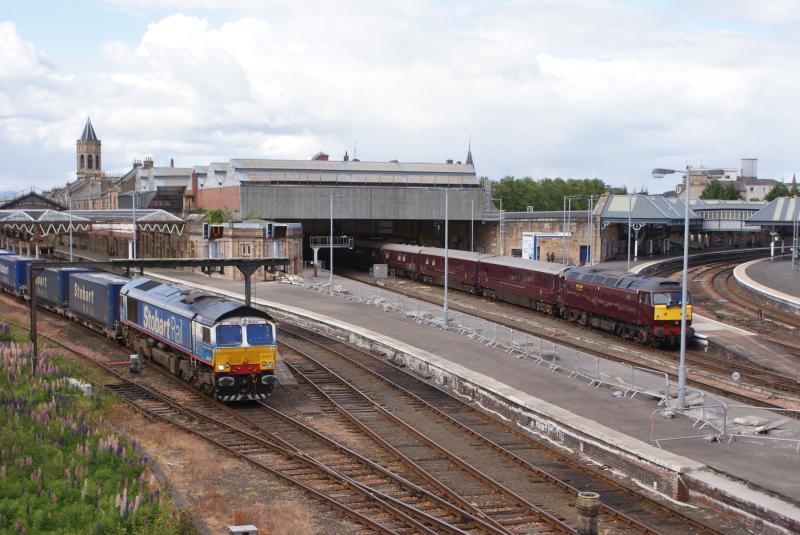 66414 - James the Engine: Stobart Rail liveried 66414 passes WCRC 57001 'The Royal Scotsman' at Perth on 30th May 2011 Photo of 66414 - James the Engine