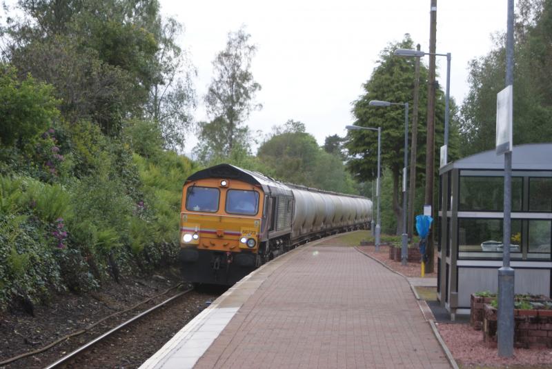 66723 'Chinook' - WHL: GBRf 66723 'Chinook' makes a short stop at Helensburgh Upper heading southbound with it's Alcans on the evening of 31st May 2011 Photo of 66723 'Chinook' - WHL