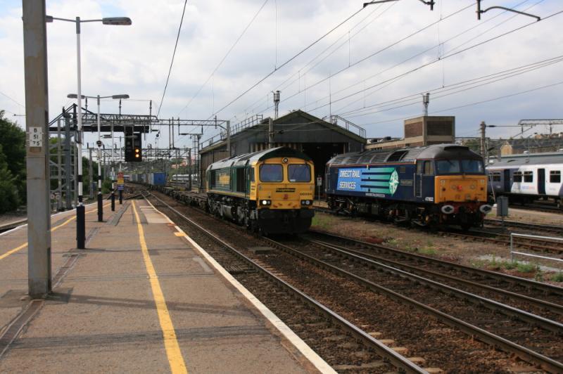 66594 passing Colchester Thunderbird: 66594 on a Freightliner for Felixstowe passing Thunderbird 47802 on Colchester MPD on 16/06/2011 Photo of 66594 passing Colchester Thunderbird