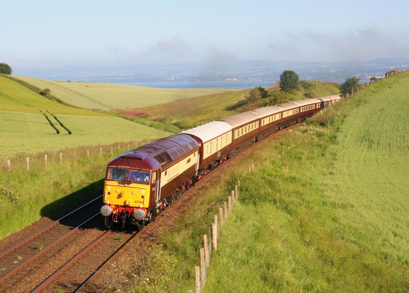 47790 5Z48 Wormit 030711:
Recently repainted and now with nameplates 'Galloway Princess' fitted 47790 looks superb as she passes Wormit on 3rd July 2011 working 5Z48 Dundee to Edinburgh ECS Northern Belle Photo of 47790 5Z48 Wormit 030711