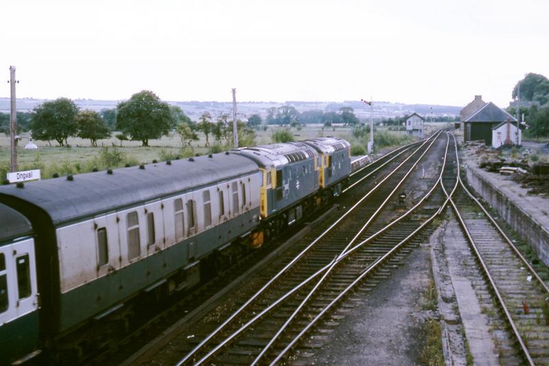 Dingwall in 1984: 26032+26038 on the 1800 Wick - Inverness on 7 July 1984.
There had been a loco change at Brora to get them back to Inverness having come north on the 1735 from Inverness. Photo of Dingwall in 1984