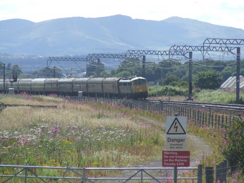 GBRF Staff Outing approaching Prestonpans: 86101 approaching Prestonpans on GBRF staff outing return to Retford on 23 July 2011 - modern infrastructure on view includes warning sign, OHL, colour light signal Photo of GBRF Staff Outing approaching Prestonpans