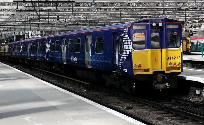 314212 at Glasgow Central: The first of the few 314s to be refurbished at Springburn 314212 stands in Glasgow Central on Saturday 2nd July 2011. Forming the 1615 Cathcart Circle service Photo of 314212 at Glasgow Central