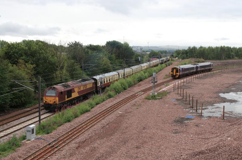 67026 on 5Z39: 67026 on 5Z39 12.30 Millerhill to Edinburgh passes 158707 waiting in the Turnback siding at Millerhill on 12/08/2011 Photo of 67026 on 5Z39