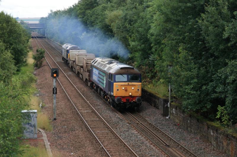 57007 on 6M50: 57007 leading topn tail 57011 on 6M50 15.07 Torness to Carlisle approaching Niddrie West Jct on 6M50 on 12/08/2011. Trees partially covering the Signal. Photo of 57007 on 6M50