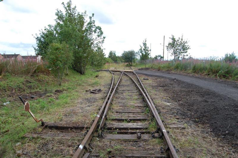 Leuchars 2: Looking towards the mainline connection. This area has had a recent tidy up & installation of a path thoughout the small area which I would imagine will be left as a small wildlife area. Photo of Leuchars 2
