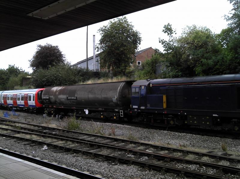 Guess where?: Some LUL stock being delivered by 4x Class 20s somewhere in OT land... Photo of Guess where?