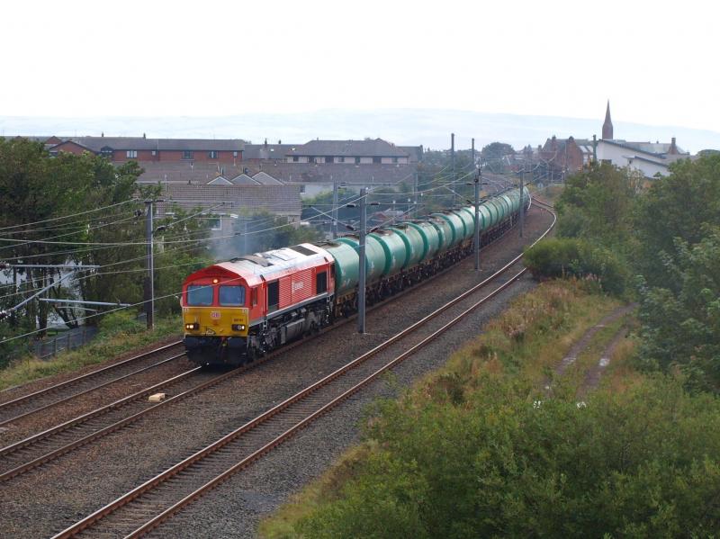 Troon - 09-09-2011: DB Schenker 66101 passes with empty avaiation fuel tankers from Prestwick Airport to Grangemouth. Photo of Troon - 09-09-2011