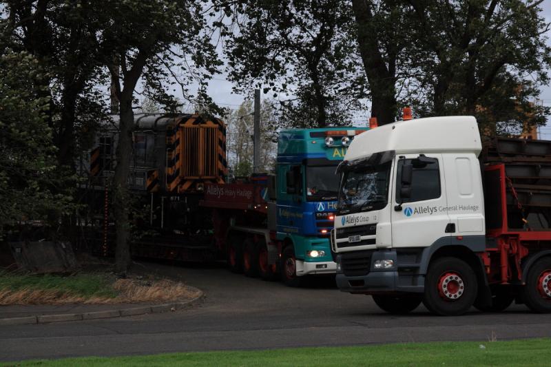 Tight Fit: There is not a lot of room for the low loader waiting for the ramp to depart. Photo of Tight Fit