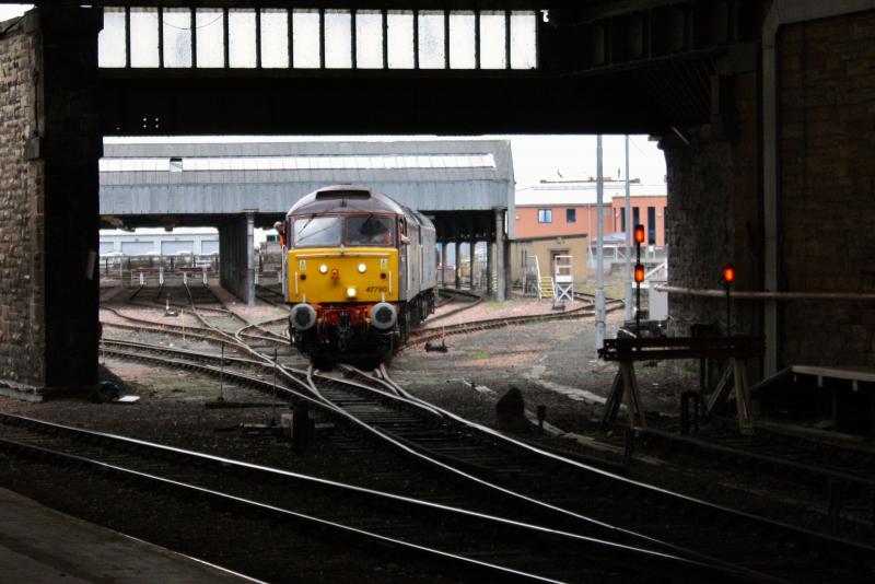 47790 pushes failed 47818 into the carriage shed: Photo of 47790 pushes failed 47818 into the carriage shed